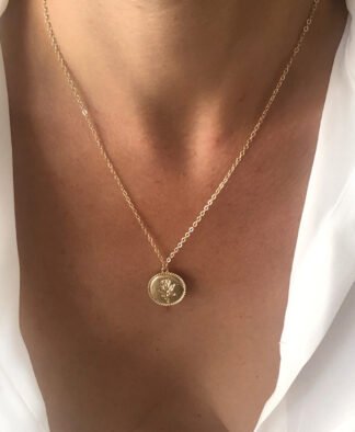 Collier dore medaille fleur