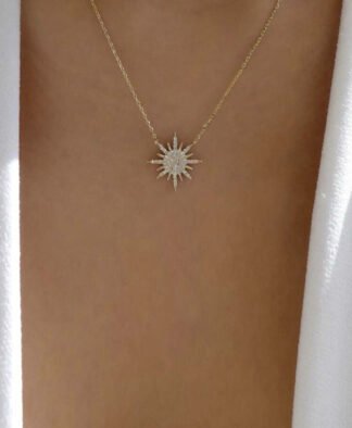 Collier fantaisie pendentif soleil strass dore