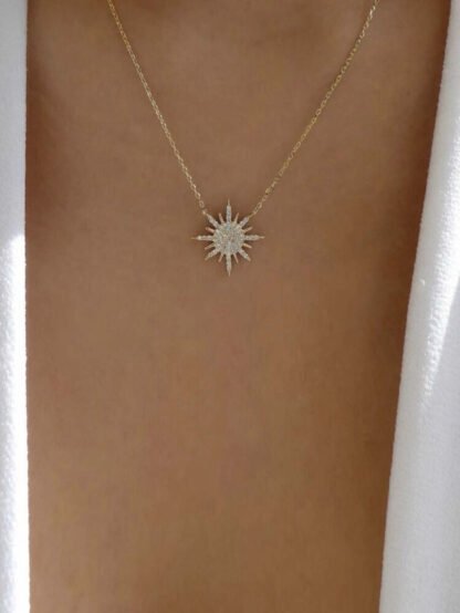 Collier fantaisie pendentif soleil strass dore